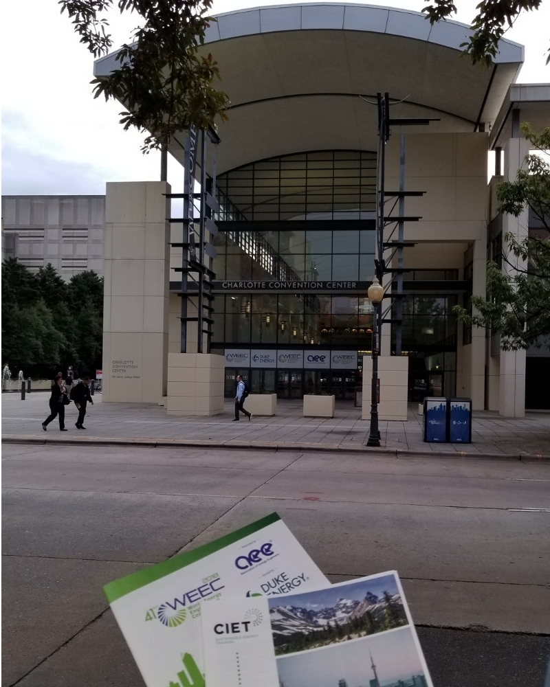 CIET Canada brochure and WEEC brochure in front of the Charlotte Convention Center Doors